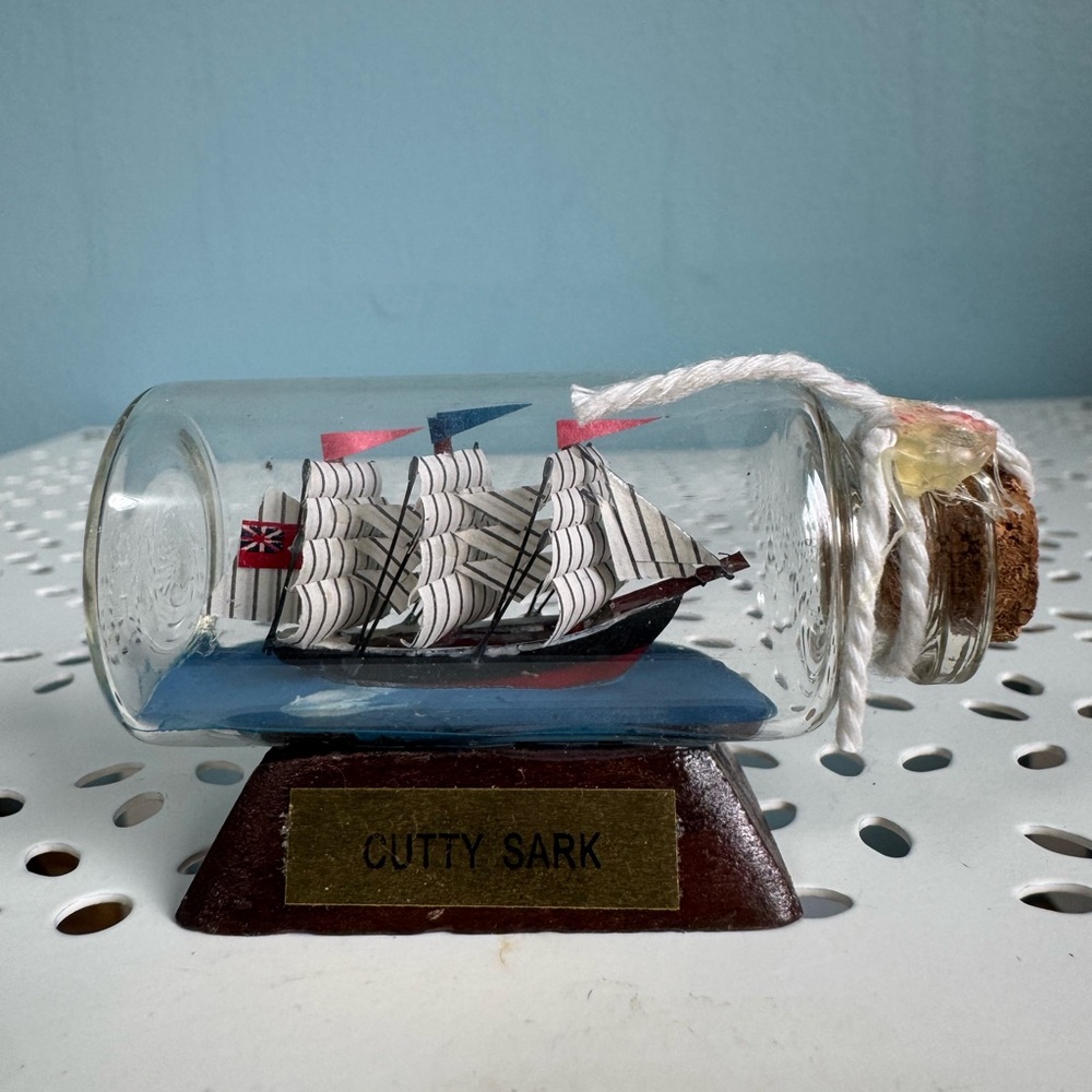 Cutty Sark ship in miniature bottle.